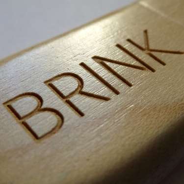 Photograph of wooden Flash drive engraved with the word BRINK